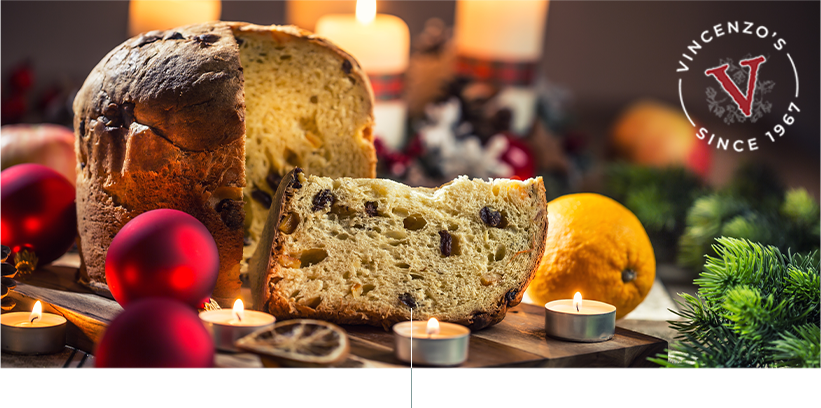 Panetone italian christmas dessert on table with festive decorations.